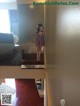 A woman taking a picture of herself in a mirror.